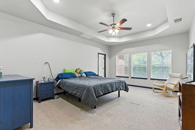230 Hoffman Rd, Bastrop, TX 78602 - bedroom with a raised ceiling, light carpet, recessed lighting, and a ceiling fan