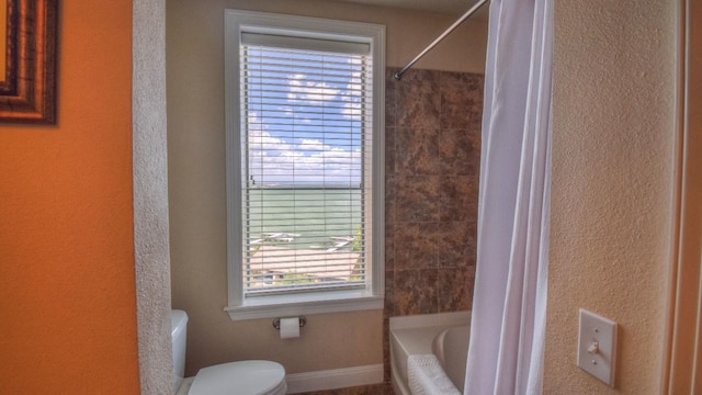 101 W Bank Unit 51, Horseshoe Bay, TX 78657 - full bathroom featuring shower / bath combination with curtain and a textured wall