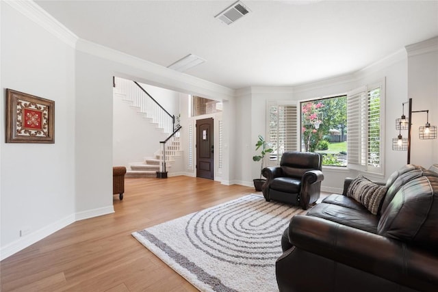 10636 Bramblecrest Dr, Austin, TX 78726 - living room with light wood-type flooring, ornamental molding, and stairway