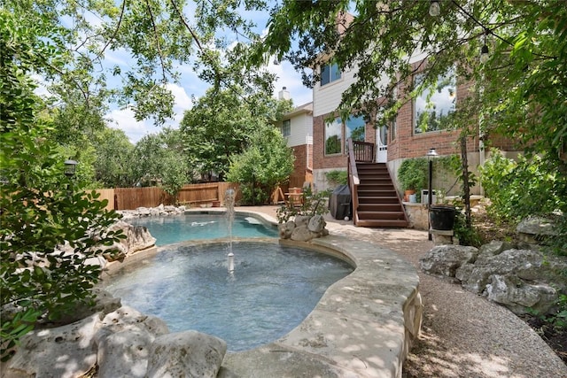 10636 Bramblecrest Dr, Austin, TX 78726 - view of pool with a fenced backyard, a pool with connected hot tub, stairway, and a patio area