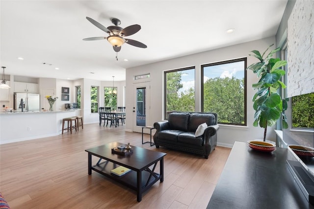 10636 Bramblecrest Dr, Austin, TX 78726 - living room with a ceiling fan, light wood-style floors, and recessed lighting