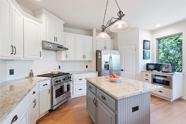 10636 Bramblecrest Dr, Austin, TX 78726 - kitchen featuring appliances with stainless steel finishes, gray cabinets, under cabinet range hood, white cabinetry, and recessed lighting