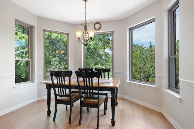 10636 Bramblecrest Dr, Austin, TX 78726 - dining area featuring a chandelier and light wood finished floors