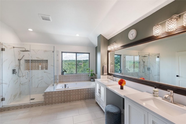 10636 Bramblecrest Dr, Austin, TX 78726 - full bath featuring a garden tub, double vanity, a marble finish shower, vaulted ceiling, and recessed lighting