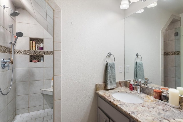 10636 Bramblecrest Dr, Austin, TX 78726 - bathroom featuring vanity and a tile shower