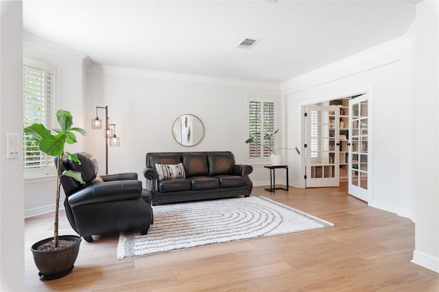 10636 Bramblecrest Dr, Austin, TX 78726 - living room with crown molding, wood finished floors, and french doors