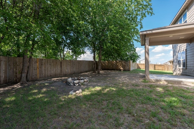 1698 Violet Ln, Kyle, TX 78640 - fenced backyard with a patio area