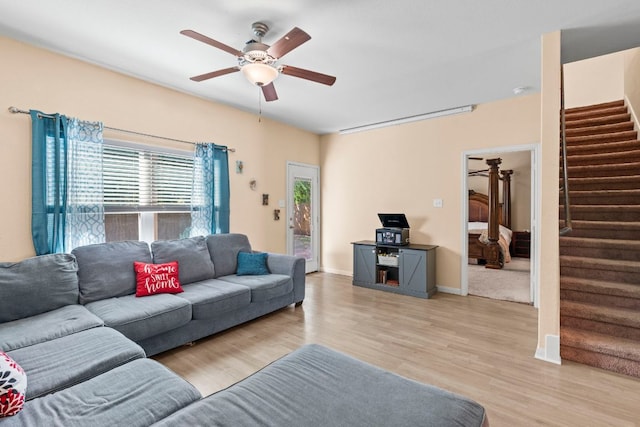 1698 Violet Ln, Kyle, TX 78640 - living area featuring ceiling fan, stairs, and light wood-style floors