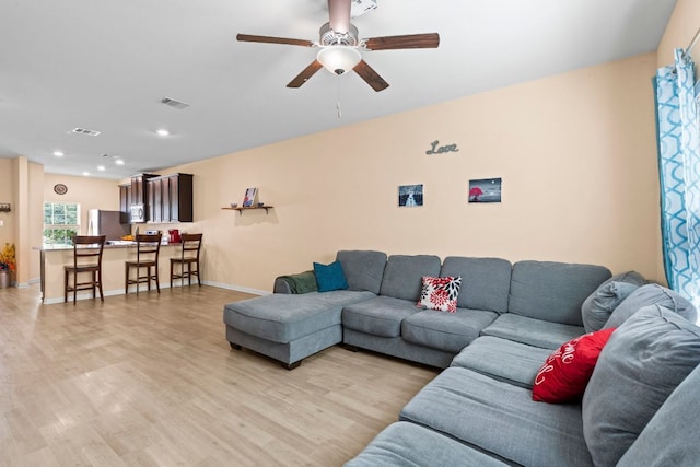 1698 Violet Ln, Kyle, TX 78640 - living area featuring ceiling fan, light wood finished floors, and recessed lighting