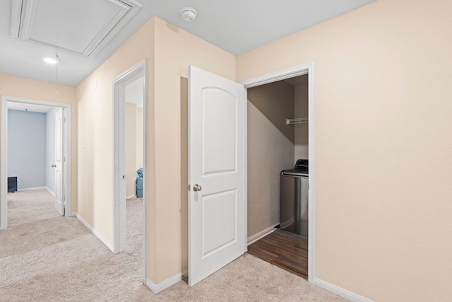 1698 Violet Ln, Kyle, TX 78640 - corridor with attic access, carpet flooring, and washer / dryer