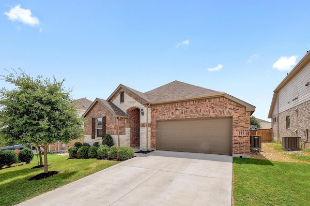 1520 Beard Pass, Leander, TX 78641 - french country inspired facade featuring brick siding, driveway, a garage, and roof with shingles
