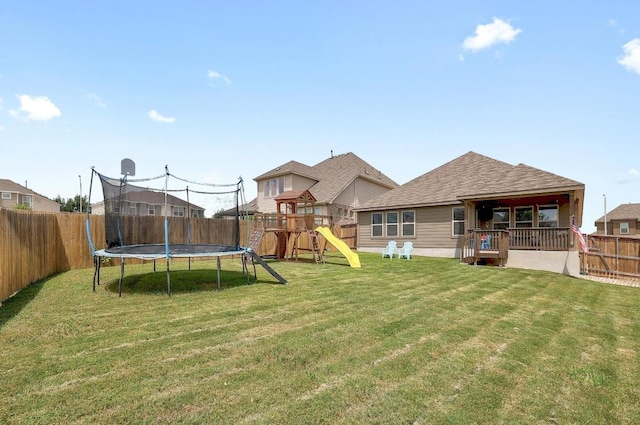1520 Beard Pass, Leander, TX 78641 - fenced backyard featuring a trampoline and a playground