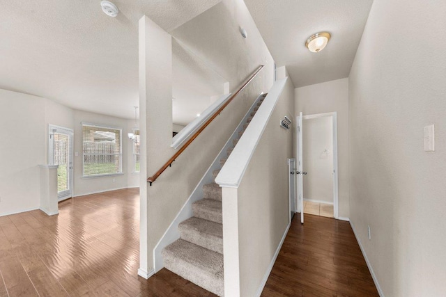 3303 Lorne Dr, Killeen, TX 76542 - stairway with wood finished floors and a chandelier