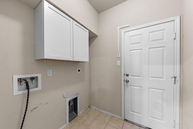 3303 Lorne Dr, Killeen, TX 76542 - washroom featuring cabinet space, washer hookup, hookup for an electric dryer, and light tile patterned floors
