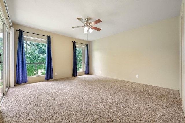 230 Lido St Unit I-2, Lakeway, TX 78734 - empty room with carpet, ceiling fan, and healthy amount of natural light