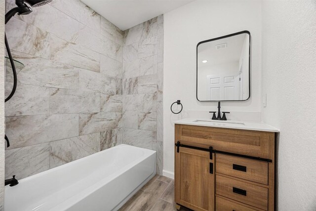 605 W Washington Ave, Copperas Cove, TX 76522 - full bath featuring vanity, tub / shower combination, and wood finished floors