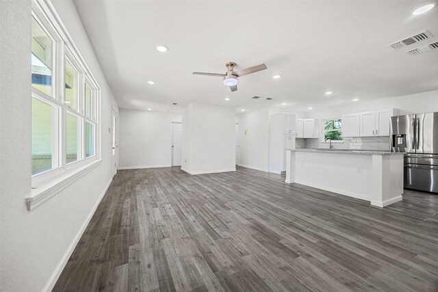 605 W Washington Ave, Copperas Cove, TX 76522 - unfurnished living room with dark wood-style floors, recessed lighting, and a ceiling fan