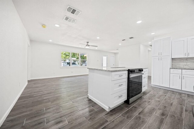 605 W Washington Ave, Copperas Cove, TX 76522 - kitchen featuring ceiling fan, wall oven, recessed lighting, dark wood-style flooring, and open floor plan