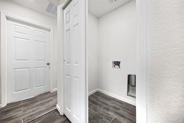 605 W Washington Ave, Copperas Cove, TX 76522 - laundry area featuring wood tiled floors, hookup for a washing machine, and heating unit