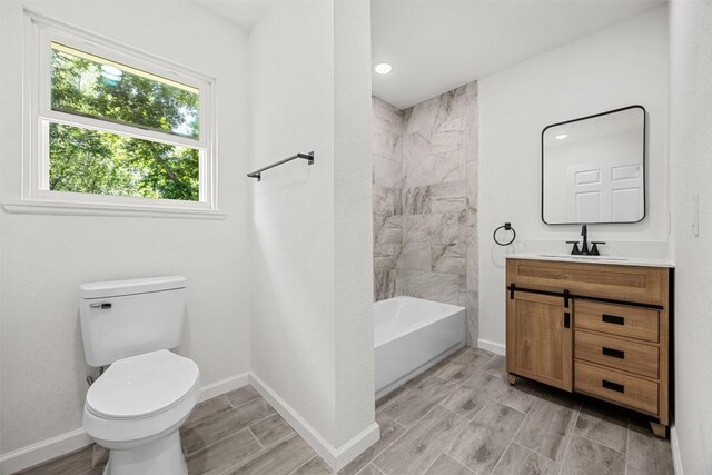 605 W Washington Ave, Copperas Cove, TX 76522 - bathroom featuring vanity, shower / bath combination, and wood tiled floors