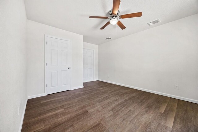 605 W Washington Ave, Copperas Cove, TX 76522 - unfurnished bedroom with dark wood-style flooring and a ceiling fan