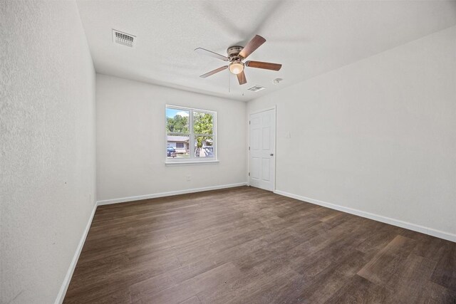 605 W Washington Ave, Copperas Cove, TX 76522 - empty room featuring a ceiling fan and dark wood-type flooring