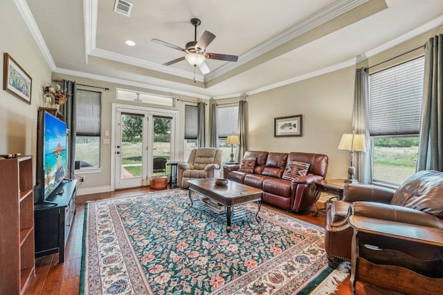 2010 American Dr Unit 2, Lago Vista, TX 78645 - living area featuring a raised ceiling, ornamental molding, a ceiling fan, and wood finished floors
