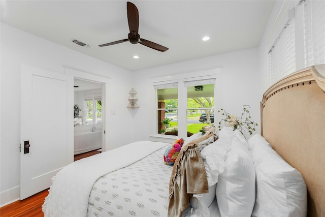1502 Olive St, Georgetown, TX 78626 - bedroom with wood finished floors, recessed lighting, and ceiling fan
