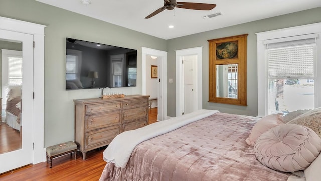 1502 Olive St, Georgetown, TX 78626 - bedroom with wood finished floors, multiple windows, recessed lighting, and a ceiling fan