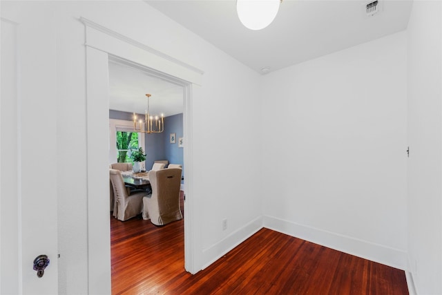 1502 Olive St, Georgetown, TX 78626 - empty room featuring dark wood finished floors and a chandelier