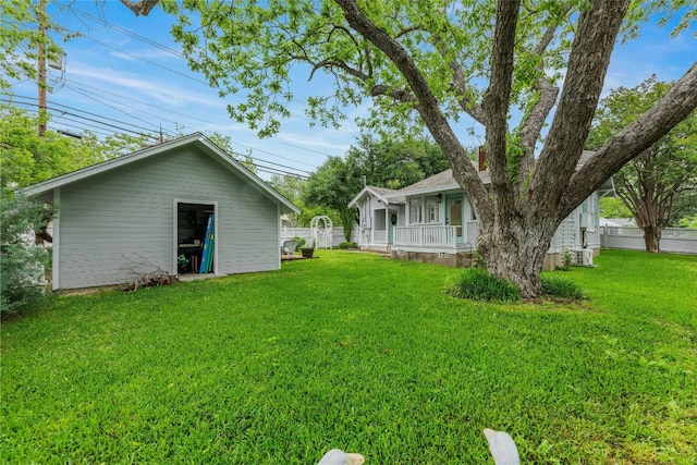 1502 Olive St, Georgetown, TX 78626 - view of yard featuring an outbuilding and a porch