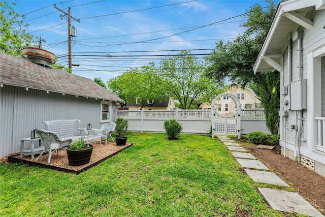 1502 Olive St, Georgetown, TX 78626 - view of yard featuring a gate and outdoor lounge area