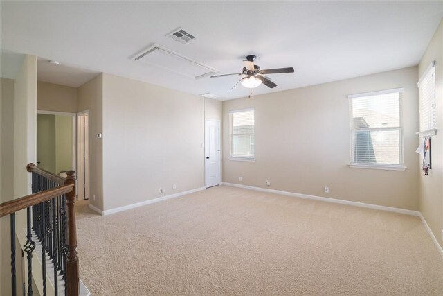 2524 Muzzie Ln, Leander, TX 78641 - spare room with attic access, light carpet, and ceiling fan
