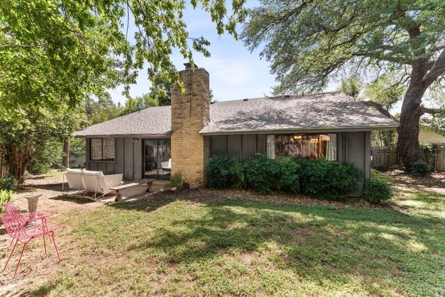 4903 Big Trail Cir, Austin, TX 78759 - rear view of house with board and batten siding, a chimney, and a shingled roof