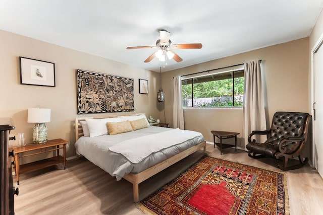 4903 Big Trail Cir, Austin, TX 78759 - bedroom featuring light wood-style flooring and ceiling fan