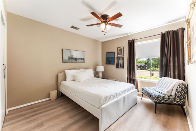 4903 Big Trail Cir, Austin, TX 78759 - bedroom featuring light wood finished floors and ceiling fan