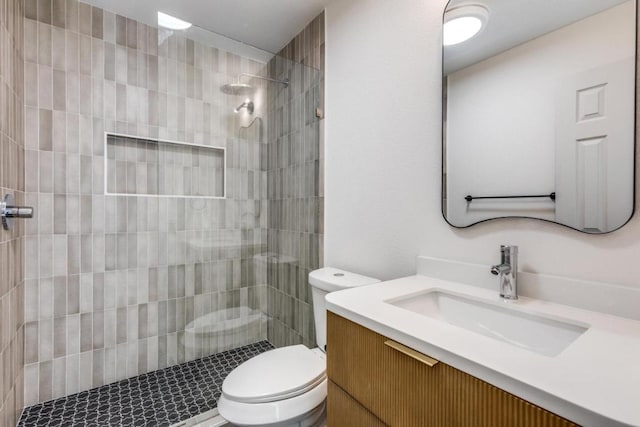 2515 Mcgregor Dr, Austin, TX 78745 - bathroom featuring vanity and a tile shower