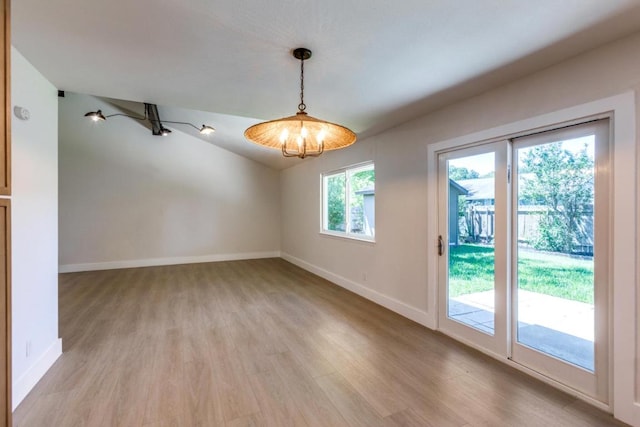2515 Mcgregor Dr, Austin, TX 78745 - empty room featuring light wood-style floors and lofted ceiling
