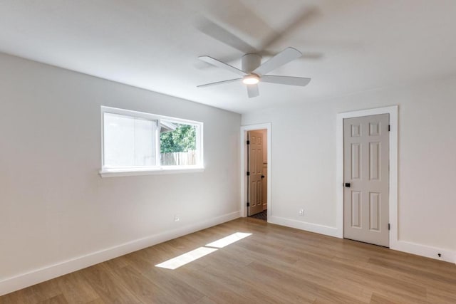 2515 Mcgregor Dr, Austin, TX 78745 - unfurnished bedroom with light wood finished floors and ceiling fan
