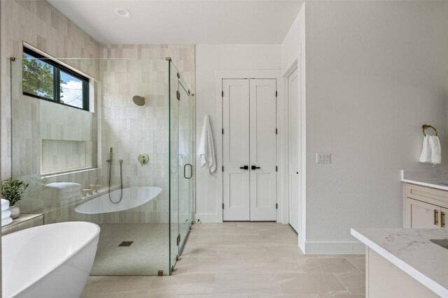1129 Madrone Rd, Fischer, TX 78623 - full bathroom with vanity, a stall shower, and a freestanding bath