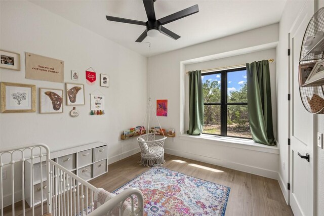 1129 Madrone Rd, Fischer, TX 78623 - bedroom with wood finished floors and ceiling fan
