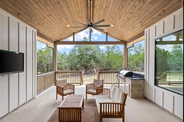 1129 Madrone Rd, Fischer, TX 78623 - sunroom / solarium with ceiling fan, an outdoor hangout area, vaulted ceiling, and view of scattered trees