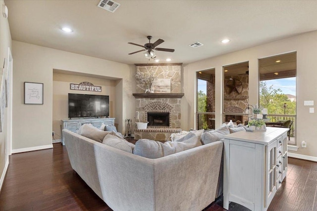 2308 First Vw, Leander, TX 78641 - living room with ceiling fan, healthy amount of natural light, a stone fireplace, dark wood-style floors, and recessed lighting