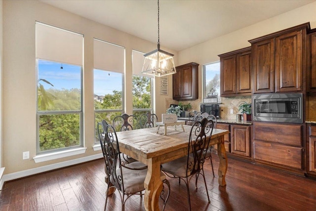 2308 First Vw, Leander, TX 78641 - dining area featuring a chandelier and dark wood-style floors