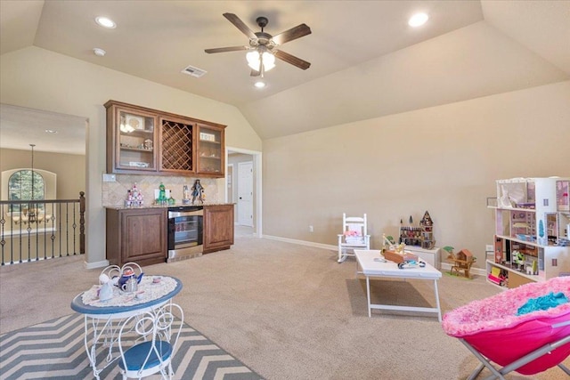 2308 First Vw, Leander, TX 78641 - living room featuring wine cooler, light colored carpet, lofted ceiling, a bar, and a ceiling fan