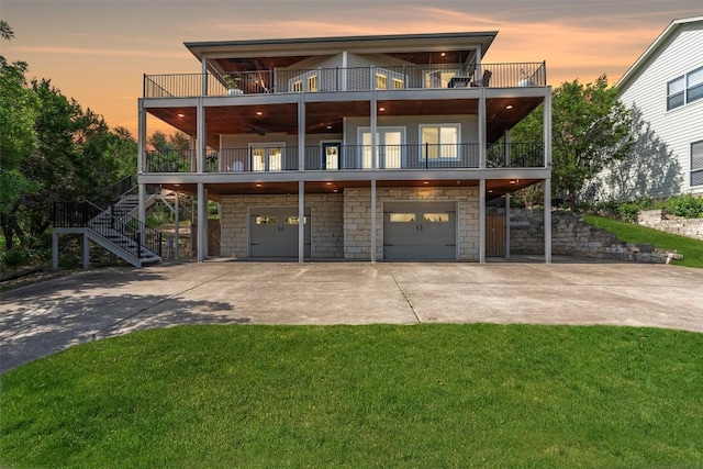 18917 Peckham Dr, Point Venture, TX 78645 - view of front of property featuring a balcony, driveway, and a garage