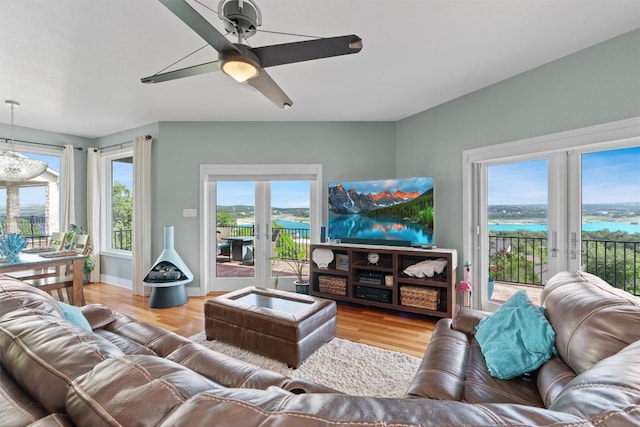 18917 Peckham Dr, Point Venture, TX 78645 - living room with healthy amount of natural light, light wood-type flooring, a ceiling fan, and french doors