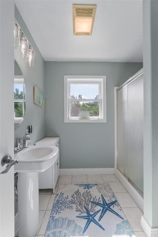18917 Peckham Dr, Point Venture, TX 78645 - bathroom with a stall shower and tile patterned floors