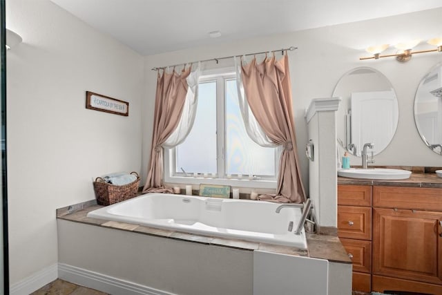 18917 Peckham Dr, Point Venture, TX 78645 - bathroom with vanity and a garden tub
