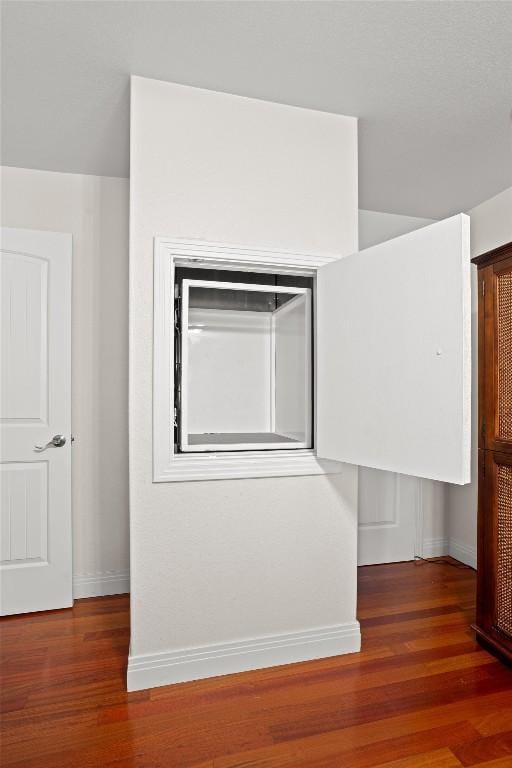 18917 Peckham Dr, Point Venture, TX 78645 - spare room with baseboards and wood finished floors
